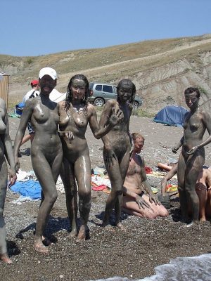 Nudist having fun with mud